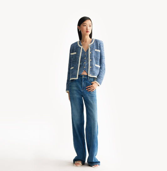 Blue tweed jacket with contrast ribbed trim, signature metal buttons, and subtle sequin details. Blue tweed jacket with contrast ribbed trim, signature metal buttons, and subtle sequin details. front-view