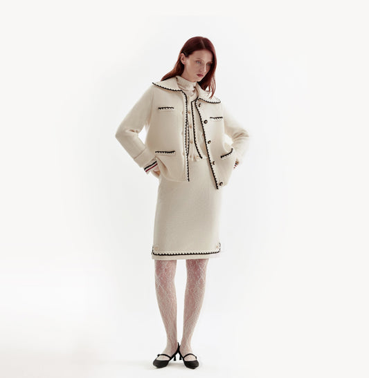 White wool-cashmere jacket for ladies with a wide lapel and hand-crocheted trim detailing. front-view