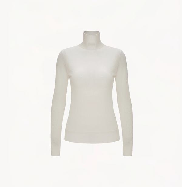 Cashmere metallic top in white with turtleneck. 