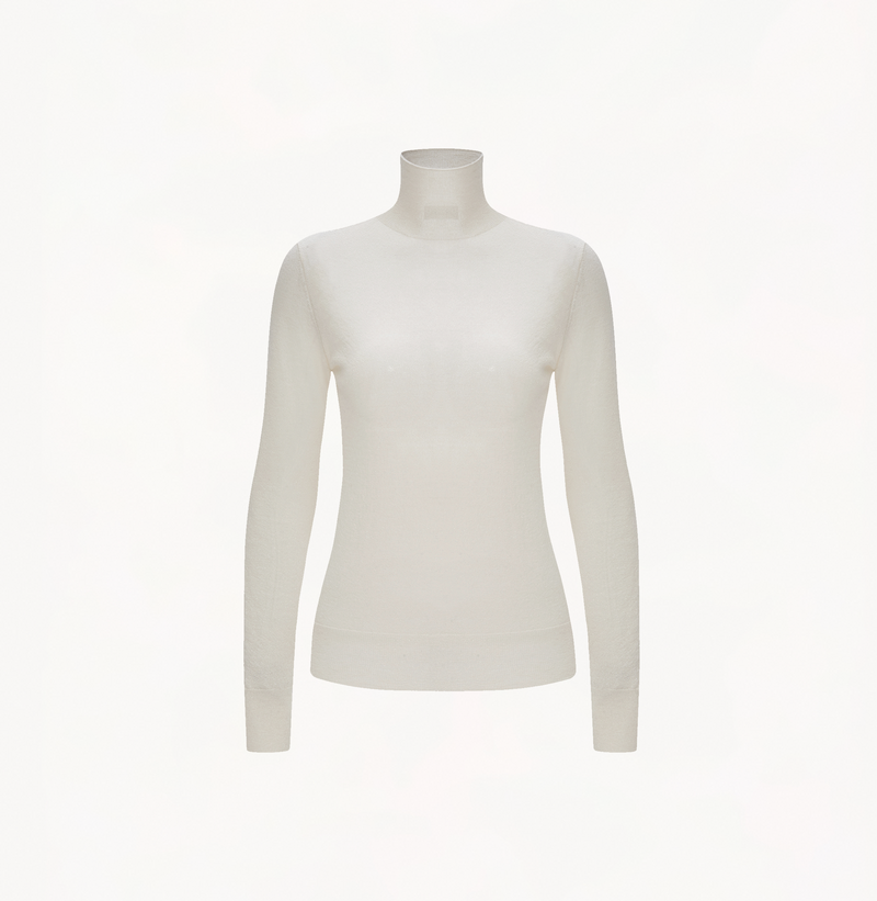 Cashmere metallic top in white with turtleneck. 