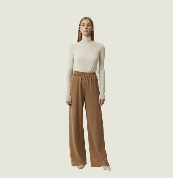 Wool lounge pants in camel. front-view