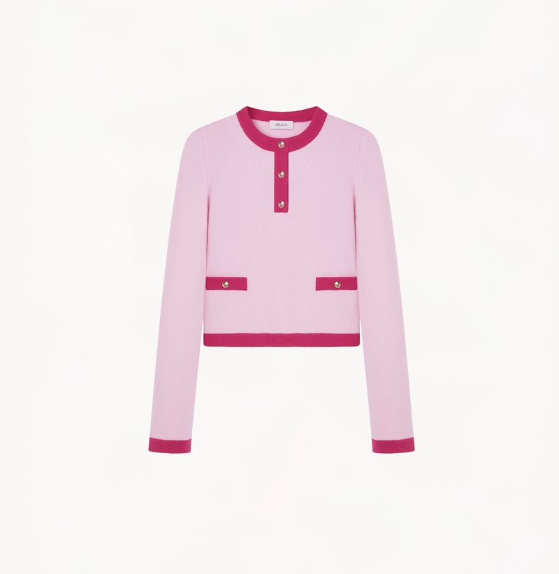 Cashmere colorblock sweater in pink and fushia with buttons in the front.