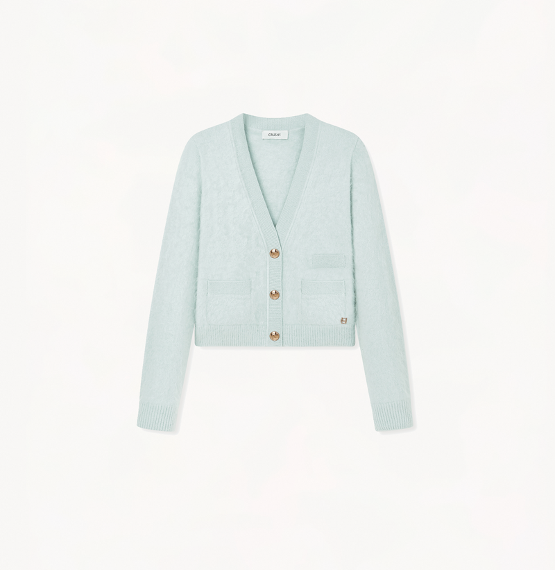 Cropped cashmere cardigan with v-neck in light green.