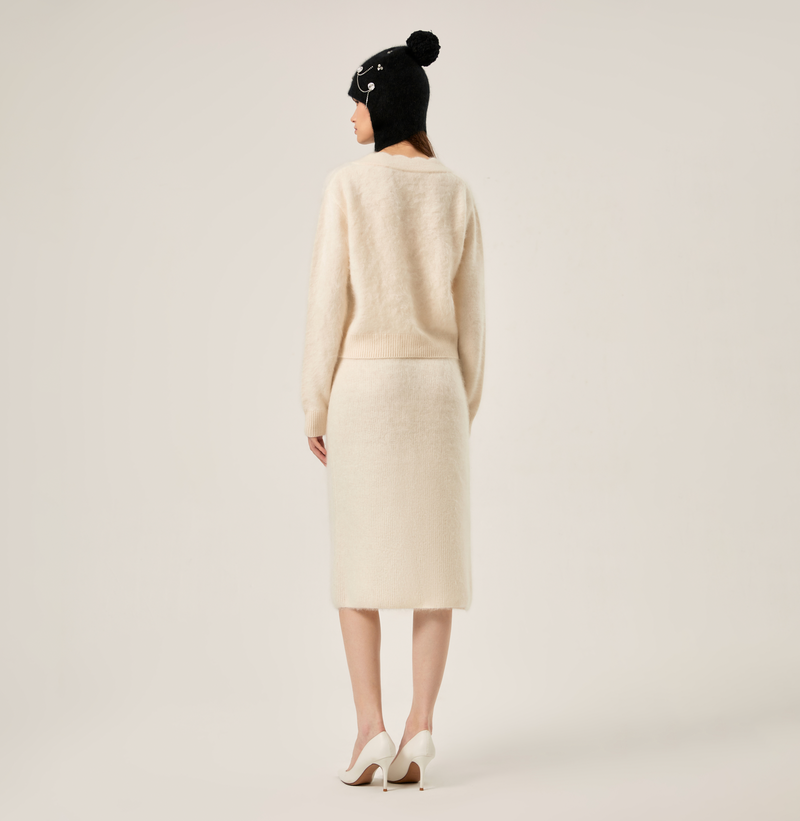 Cashmere v-neck women cardigan in white. rear-view