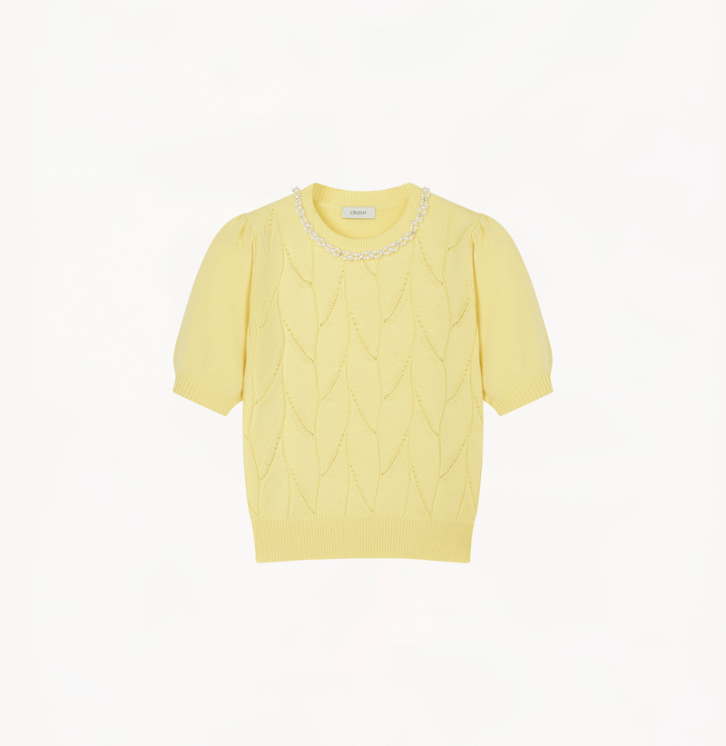Wool pointelle knit sweater in moonlight yellow with balloon sleeves.