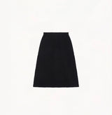 Black A line midi skirt with embossed jacquard texture built in side pockets and structured waist hem details.