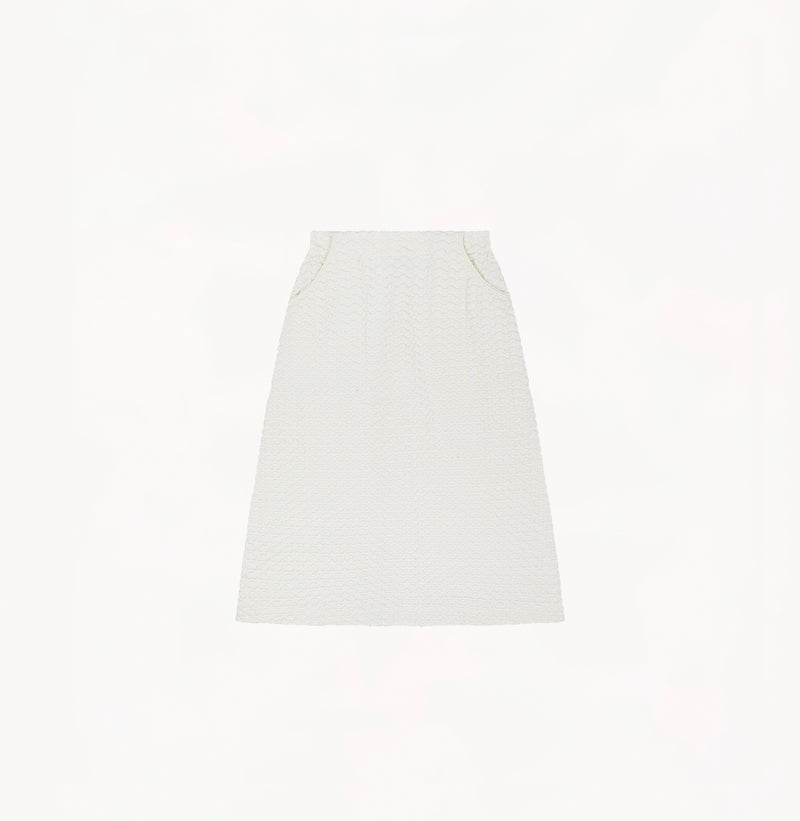 White A line midi skirt with embossed jacquard texture built in side pockets and structured waist hem details.