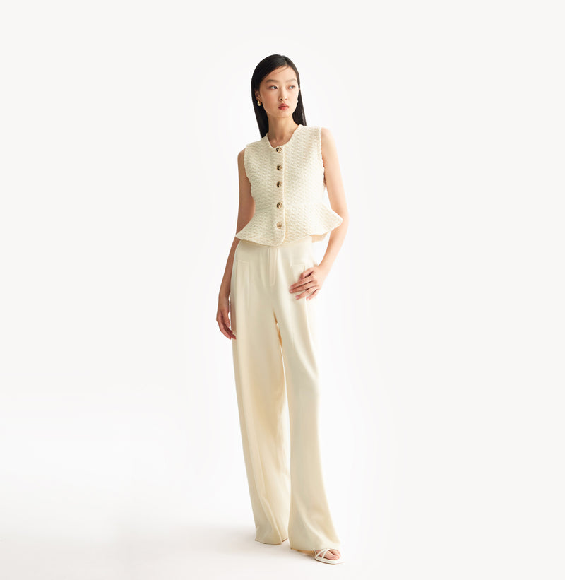 White womens fitted vest in wool blend stretch fabric with cinched waist flared hem and seamless edge trim.