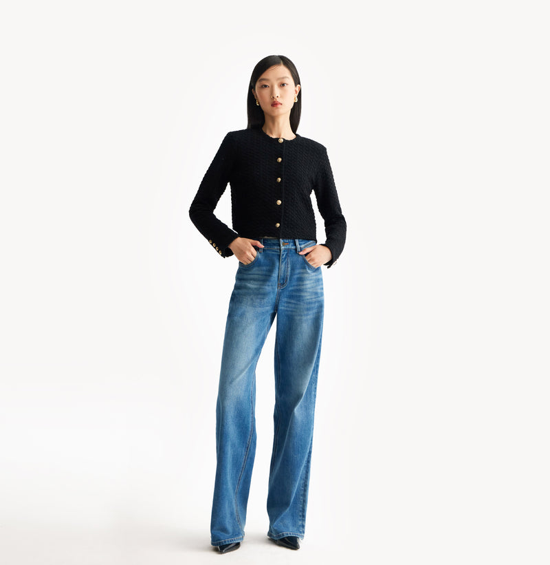 Black jacquard-textured sweater jacket in wool blend with boxy silhouette and long sleeves. front-view.