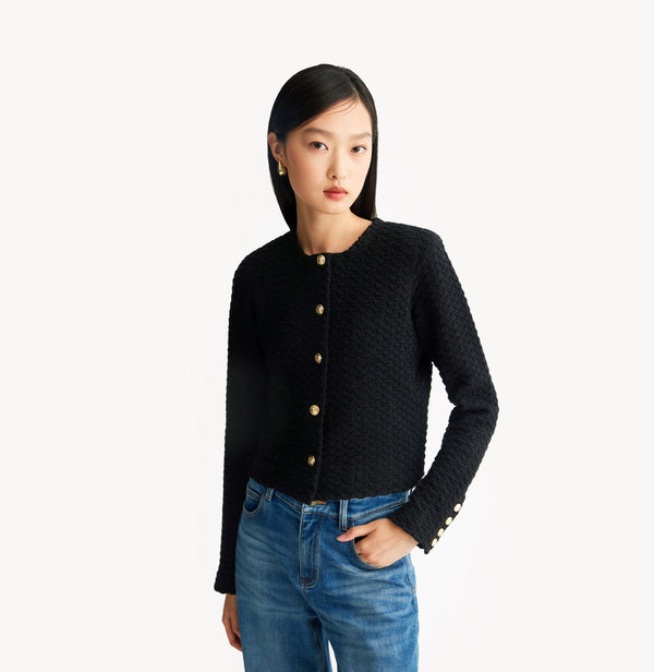 Black jacquard-textured sweater jacket in wool blend with boxy silhouette and long sleeves. left-view.