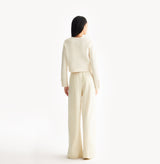 White jacquard-textured sweater jacket in wool blend with boxy silhouette and long sleeves.