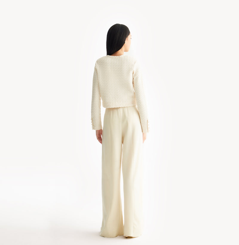 White jacquard-textured sweater jacket in wool blend with boxy silhouette and long sleeves.