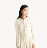 White jacquard-textured sweater jacket in wool blend with boxy silhouette and long sleeves.