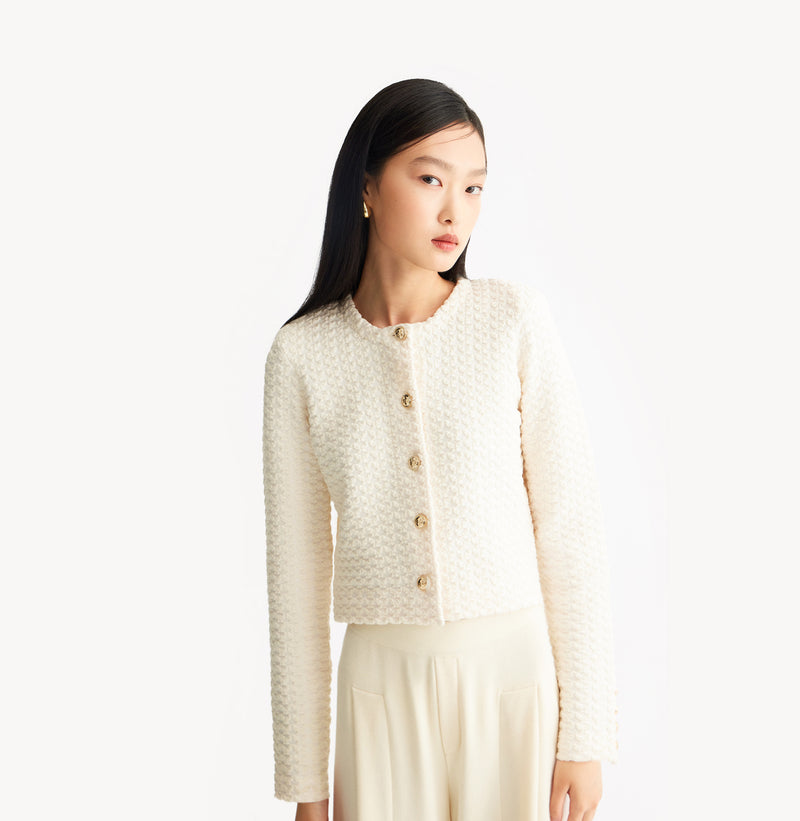 White jacquard-textured sweater jacket in wool blend with boxy silhouette and long sleeves.