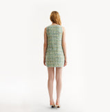 Woman wearing a green dress on a white background