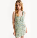 Woman wearing a green dress on a white background