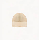 Beige baseball cap in cotton twill with embroidered monogram logo and classic beige tones.