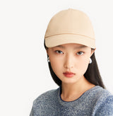 Beige baseball cap in cotton twill with embroidered monogram logo and classic beige tones. rear-view.
