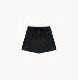 Black sheepskin shorts with relaxed pleated design and elastic waistband.