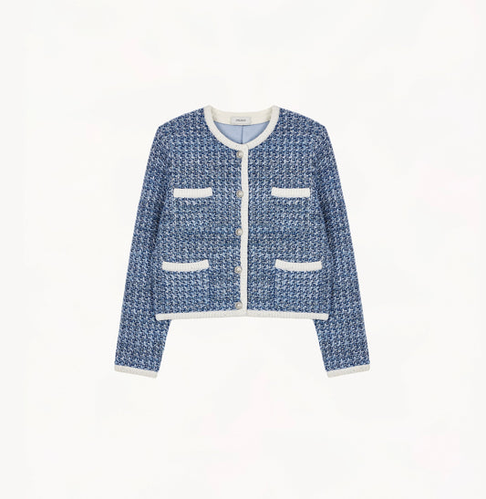 Blue tweed jacket with contrast ribbed trim, signature metal buttons, and subtle sequin details.