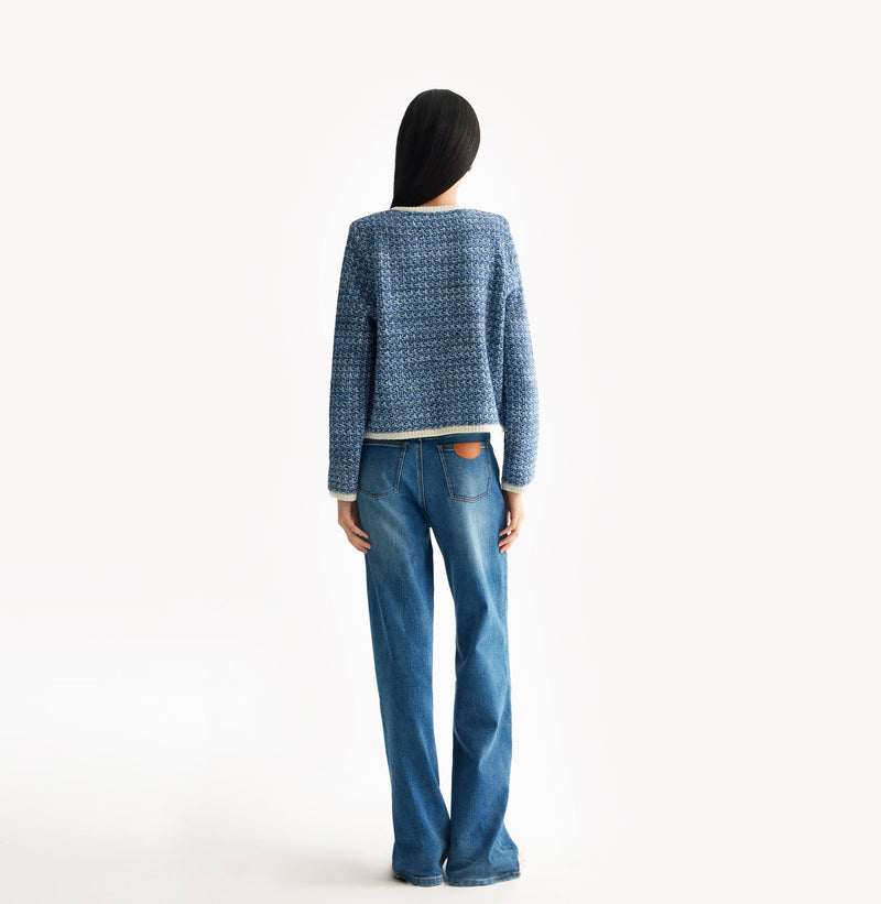 Blue tweed jacket with contrast ribbed trim, signature metal buttons, and subtle sequin details. rear-view