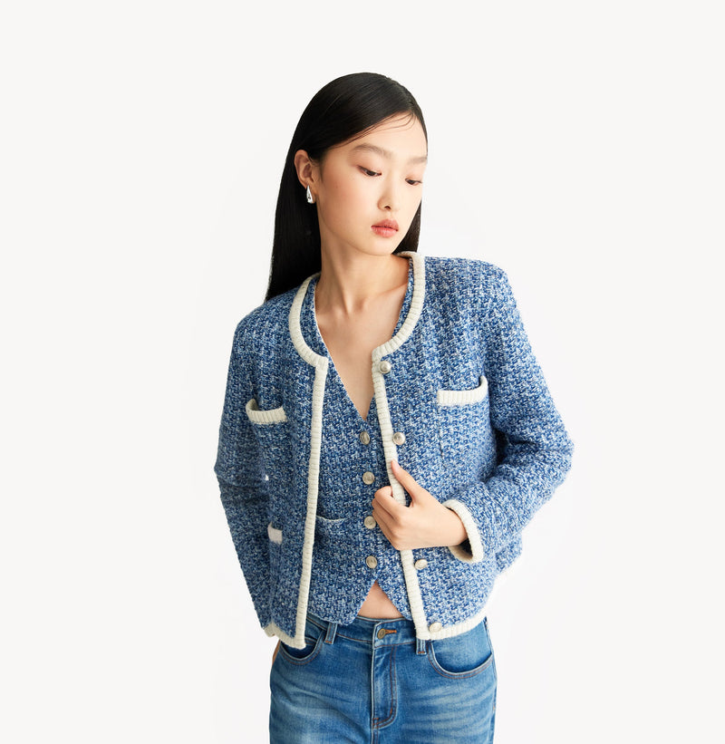 Blue tweed jacket with contrast ribbed trim, signature metal buttons, and subtle sequin details. left-view