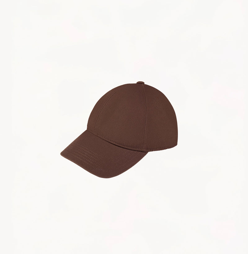 Brown baseball cap in cotton twill with embroidered monogram logo and classic coffee tones.