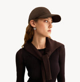 Brown baseball cap in cotton twill with embroidered monogram logo and classic coffee tones. front-view.