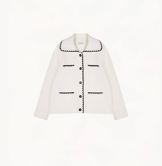 White wool-cashmere jacket for ladies with a wide lapel and hand-crocheted trim detailing.