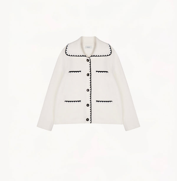 White wool-cashmere jacket for ladies with a wide lapel and hand-crocheted trim detailing.