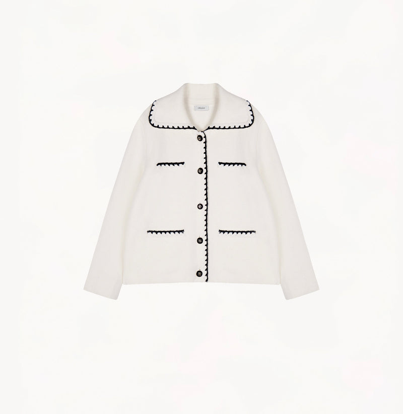 White wool-cashmere jacket for ladies with a wide lapel and hand-crocheted trim detailing.