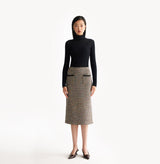 Black cashmere ribbed turtleneck top with ombré effect and metallic shimmer crafted using water soluble technology for ultra softness. front-view.