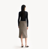Black cashmere ribbed turtleneck top with ombré effect and metallic shimmer crafted using water soluble technology for ultra softness. rear-view.