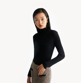 Black cashmere ribbed turtleneck top with ombré effect and metallic shimmer crafted using water soluble technology for ultra softness. left-view.