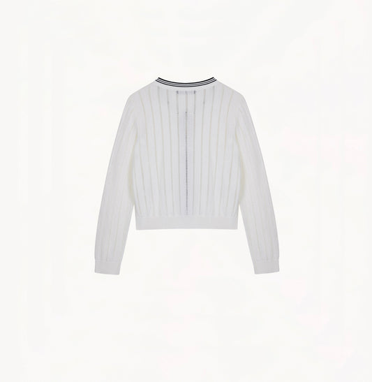 White colorblock cotton cardigan with fitted silhouette, crewneck, contrasting trim details, and decorative metal buttons.