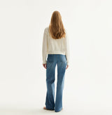 White colorblock cotton cardigan with fitted silhouette, crewneck, contrasting trim details, and decorative metal buttons. rear-view