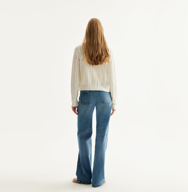 White colorblock cotton cardigan with fitted silhouette, crewneck, contrasting trim details, and decorative metal buttons. rear-view