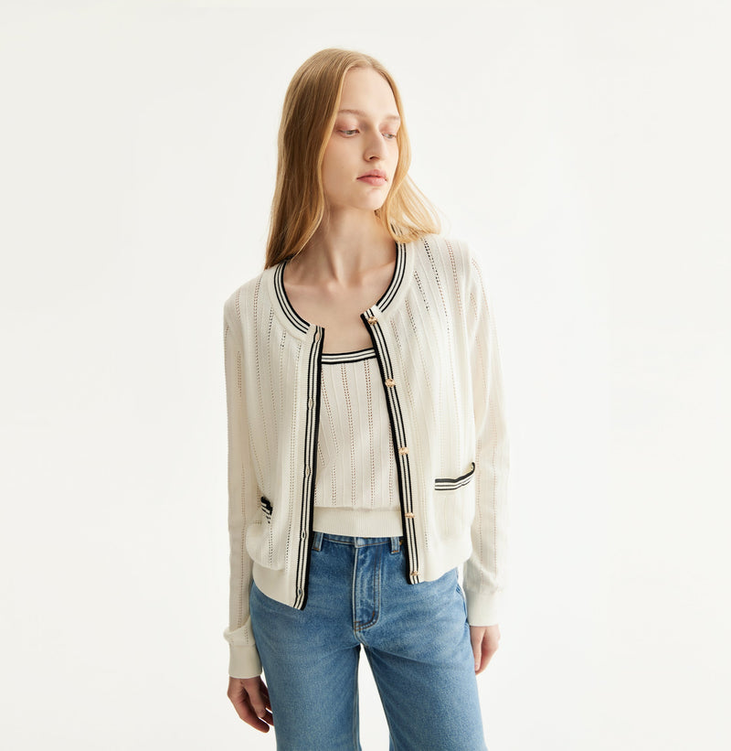 White colorblock cotton cardigan with fitted silhouette, crewneck, contrasting trim details, and decorative metal buttons. left-view