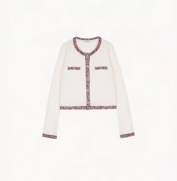 White wool-cashmere cardigan with contrast tweed trims at placket, hem, cuffs and pockets.