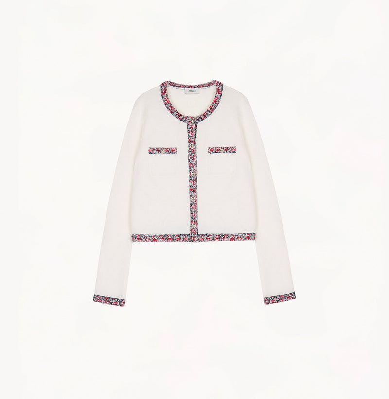 White wool-cashmere cardigan with contrast tweed trims at placket, hem, cuffs and pockets.