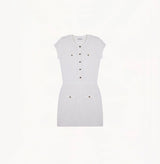White silk-cotton dress with fitted silhouette, cap sleeves, and decorative front pockets.