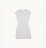White silk-cotton dress with fitted silhouette, cap sleeves, and decorative front pockets.