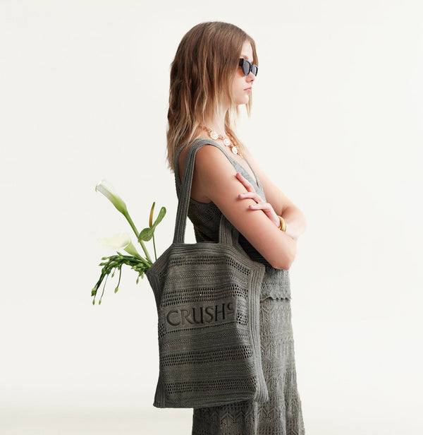 Grey green linen tote bag with pointelle stripes and 'CRUSH' embroidery. front-view