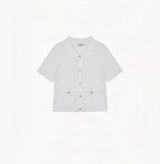 White cotton-linen diamond pointelle shirt with metallic trim and Polo collar.