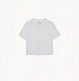 White cotton-linen diamond pointelle shirt with metallic trim and Polo collar.