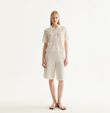White cotton-linen diamond pointelle shirt with metallic trim and Polo collar. front-view