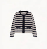 Blue female bouclé wool jacket with metallic threads, striped jacquard and shoulder pads.