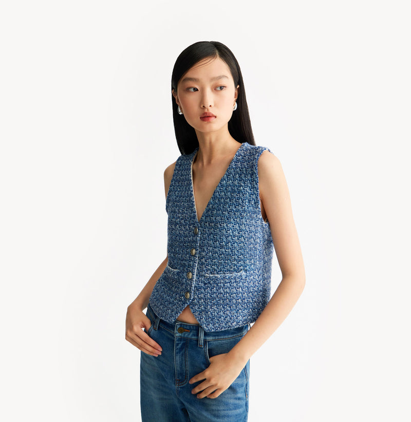 Blue ladies tweed vest with relaxed V-neck, dropped shoulders, contrast ribbed trims, and signature gold buttons. left-view