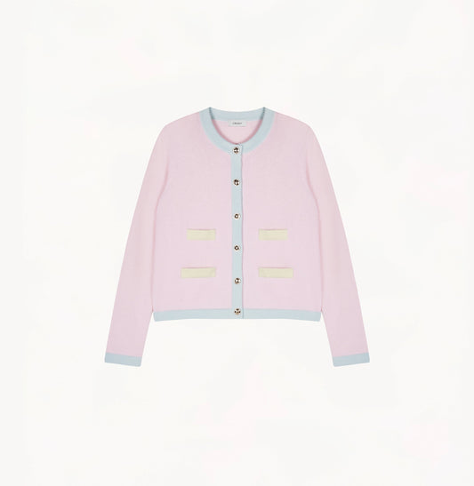 Light pink cashmere cardigan with baby blue and pale yellow contrast trims and shoulder pads.