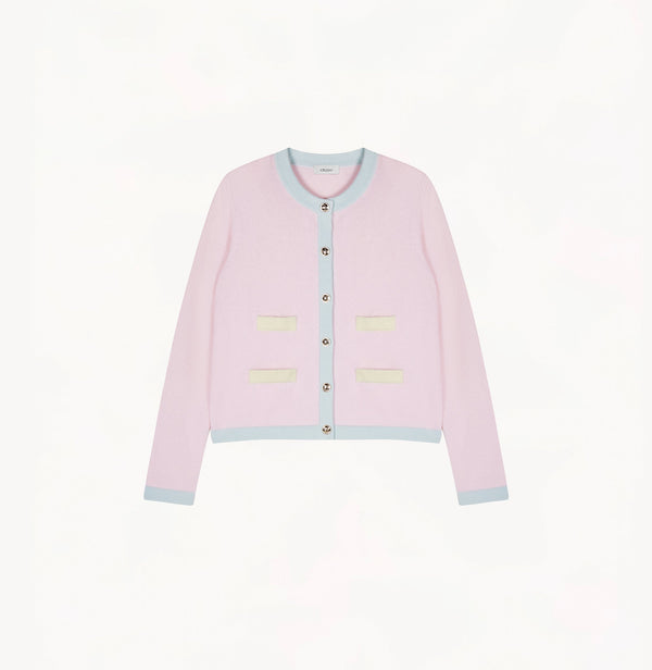 Light pink cashmere cardigan with baby blue and pale yellow contrast trims and shoulder pads.